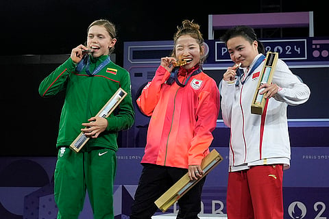 Paris Olympic Breaking B-Girls: Gold medallist Japan's Ami Yuasa, center, poses with silver medallist Lithuania's Dominika Banevic, left, and bronze medallist China's Qingyi Liu